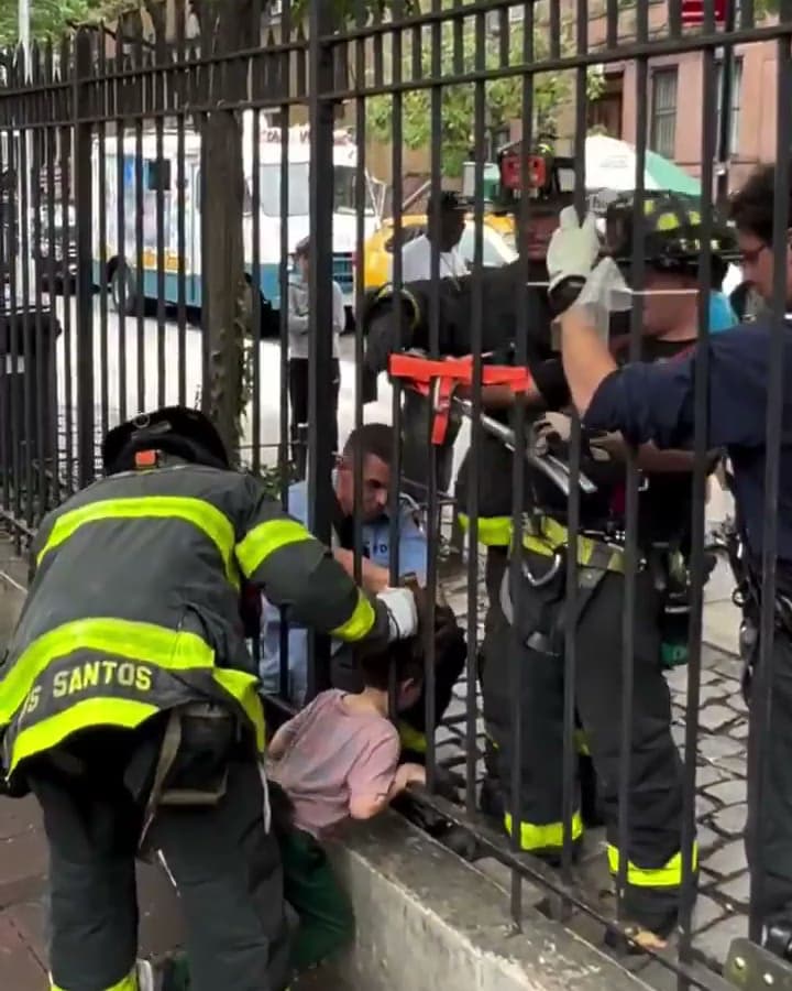 FDNY firefighters free child whose head got stuck in a fence