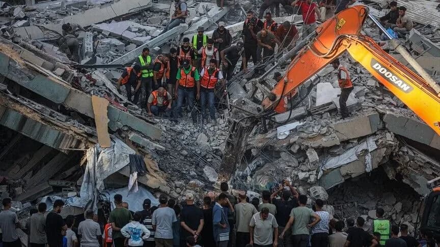 A damaged building collapsed in Gaza City, killing at least 16 people.