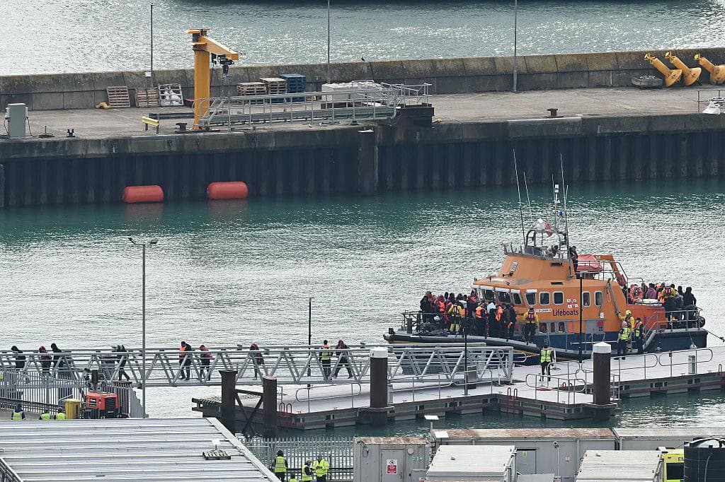 Hundreds Protest in Portsmouth After Migrant Boat Arrival, Clashing With Police